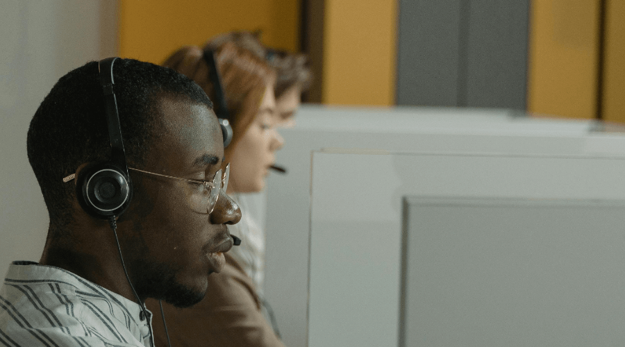 coworkers in a cubicle set up