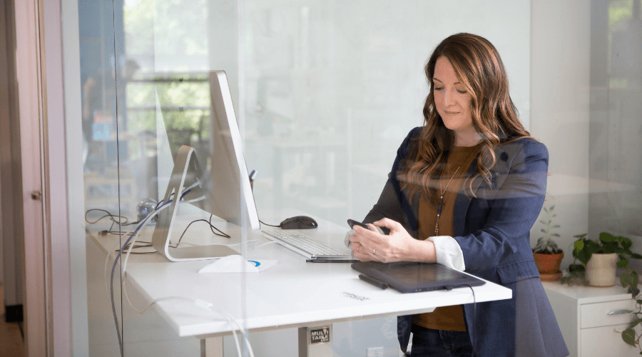 worker using standing desk